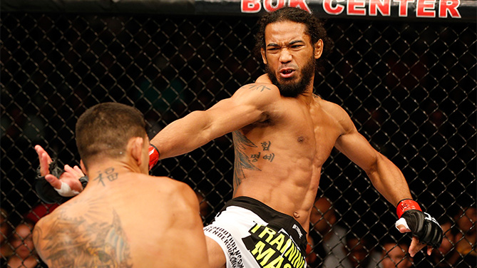 Benson Henderson delivering a powerful kick in the octagon, exemplifying the skill of UFC Lightweight Champions among the Top 10 UFC Champions in the UFC Lightweight Division. Demonstrating why he ranks among elite MMA Lightweight Champions, he contributed to memorable UFC Title Reigns.