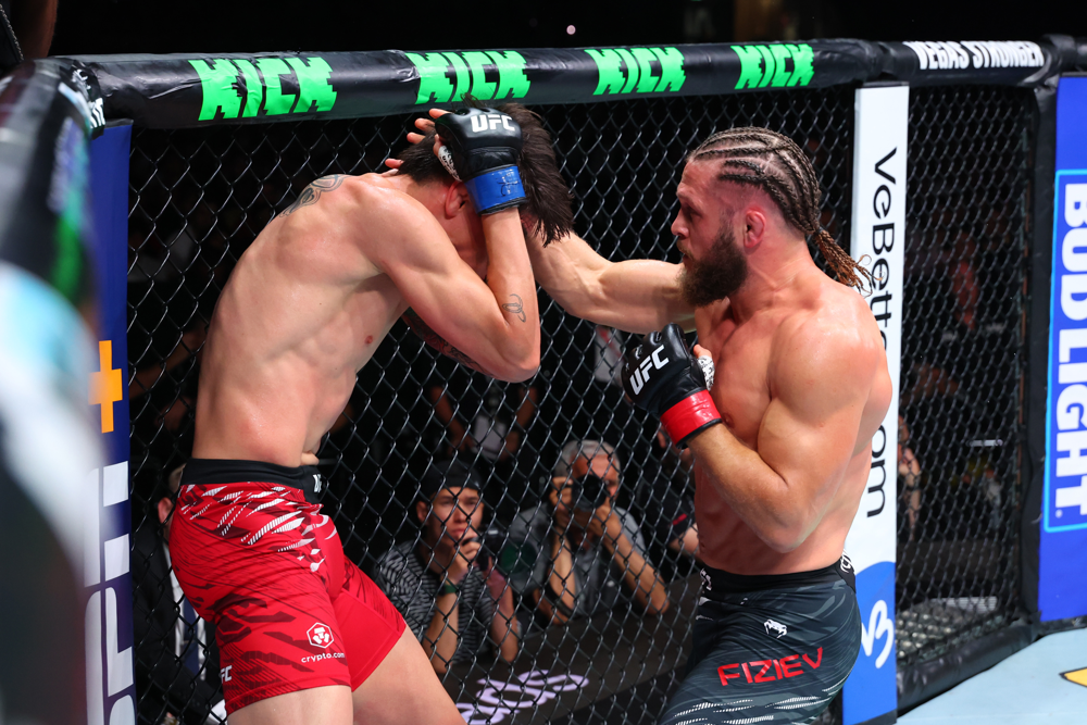 Rafael Fiziev (right) unloads punches on Ignacio Bahamondes against the fence. Fiziev’s striking skillset was on full display, earning him a dominant decision win at UFC Baku